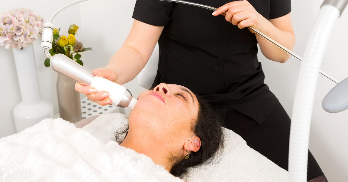 Woman getting EXION treatment.